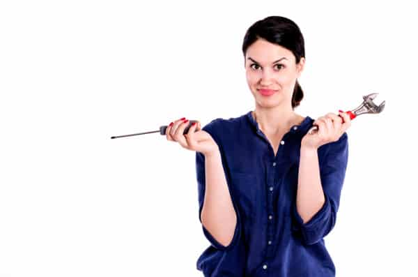 DIY Woman Holding Some Repair Tools shutterstock 277681211 e1459455068338